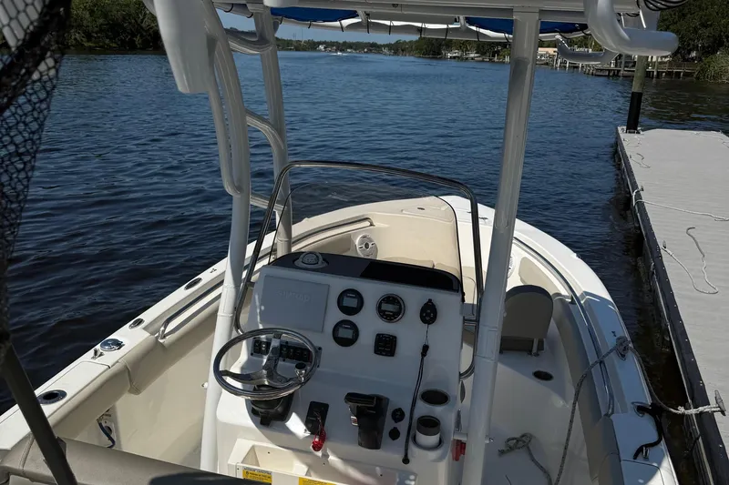 Slide: The Image of 2023 Key West 203 FS boat docked on a serene lake. - 25