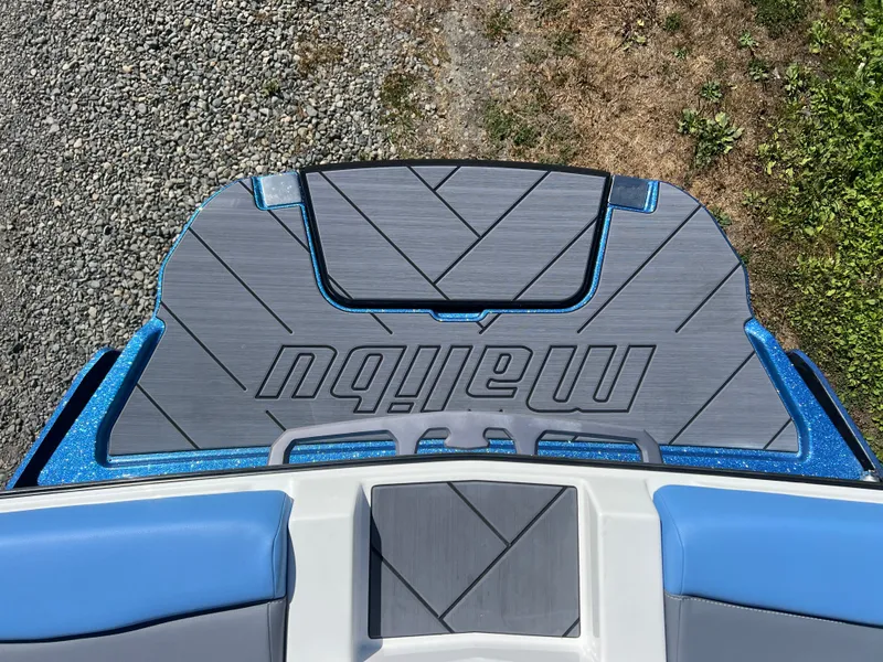 Slide: The Image of 2025 Malibu Wakesetter 23 LSV boat rear with blue glitter accent. - 21