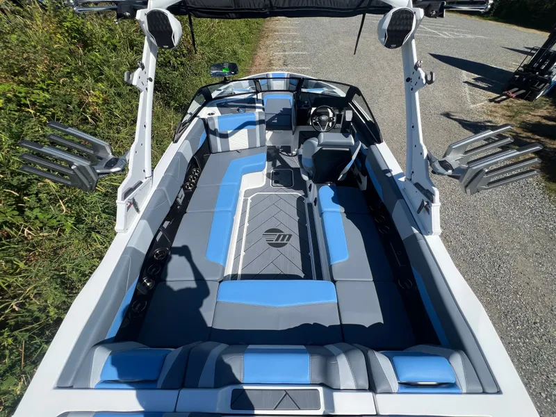 Slide: The Image of Interior of 2025 Malibu Wakesetter 23 LSV with blue and gray seating. - 22