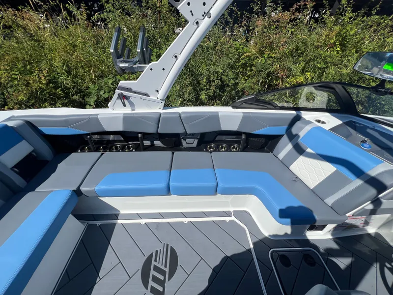 Slide: The Image of Interior of 2025 Malibu Wakesetter 23 LSV with blue and gray seating. - 23