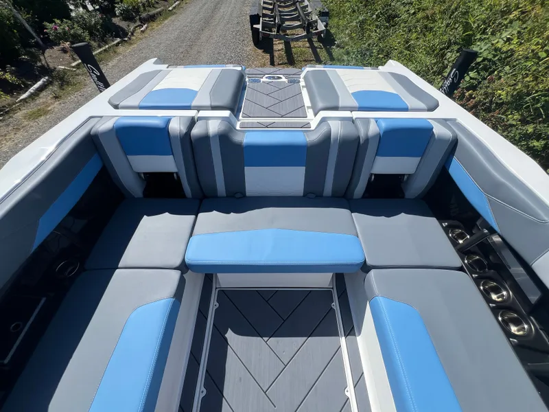 Slide: The Image of Interior of 2025 Malibu Wakesetter 23 LSV with blue and gray seating. - 24