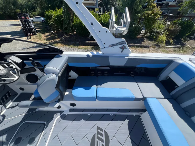 Slide: The Image of Interior of 2025 Malibu Wakesetter 23 LSV with blue and gray seating. - 25