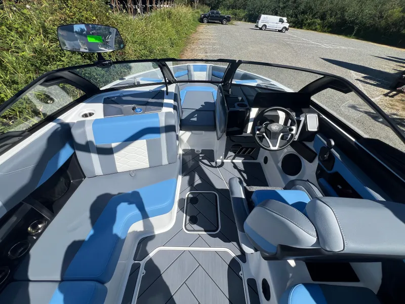 Slide: The Image of Interior of 2025 Malibu Wakesetter 23 LSV with blue seating. - 26
