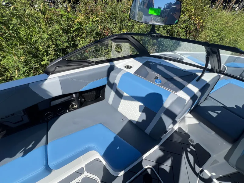 Slide: The Image of Interior of 2025 Malibu Wakesetter 23 LSV with blue seating. - 27