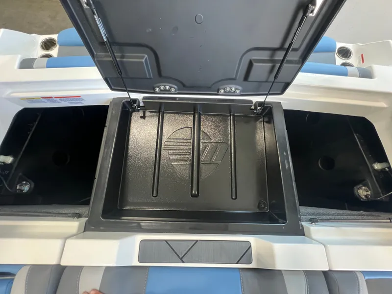Slide: The Image of 2025 Malibu Wakesetter 23 LSV storage compartment with open lid. - 31