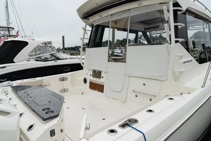 Slide: The Image of 2024 Boston Whaler 405 Conquest boat, featuring spacious deck and modern amenities. - 20