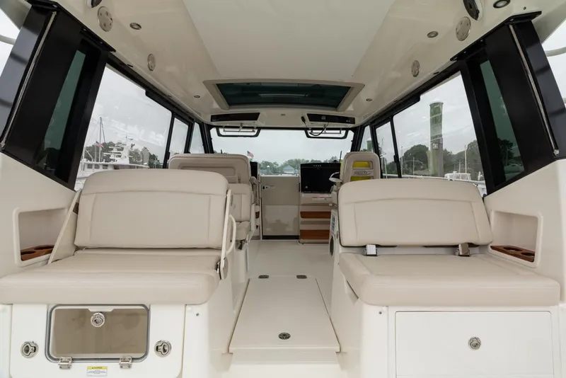 Slide: The Image of Interior of 2024 Boston Whaler 405 Conquest boat, featuring spacious seating and modern design. - 25
