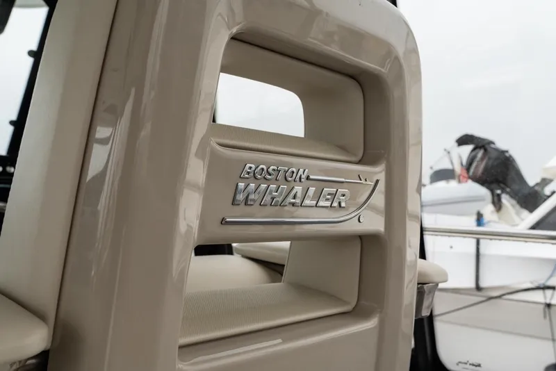 Slide: The Image of 2024 Boston Whaler 405 Conquest logo on boat interior, showcasing luxury design. - 35