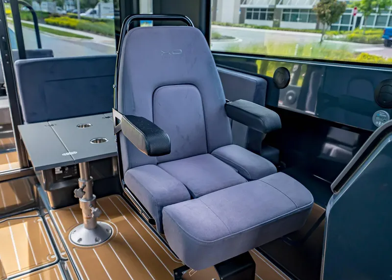 Slide: The Image of Captain's chair in 2023 XO Boats EXPLR 9, featuring sleek design and comfortable seating. - 12