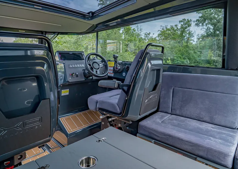 Slide: The Image of Interior of 2023 XO Boats EXPLR 9, featuring modern cockpit and seating. - 18