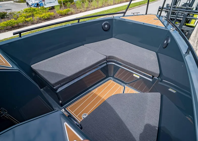 Slide: The Image of 2023 XO Boats EXPLR 9 interior seating area with cushioned benches and sleek design. - 22