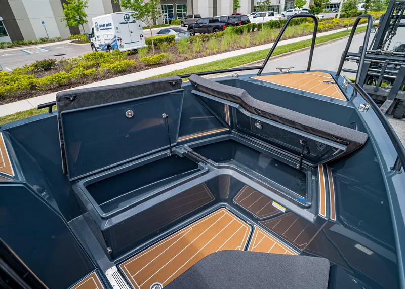 Slide: The Image of 2023 XO Boats EXPLR 9 interior with open storage compartments and sleek design. - 23