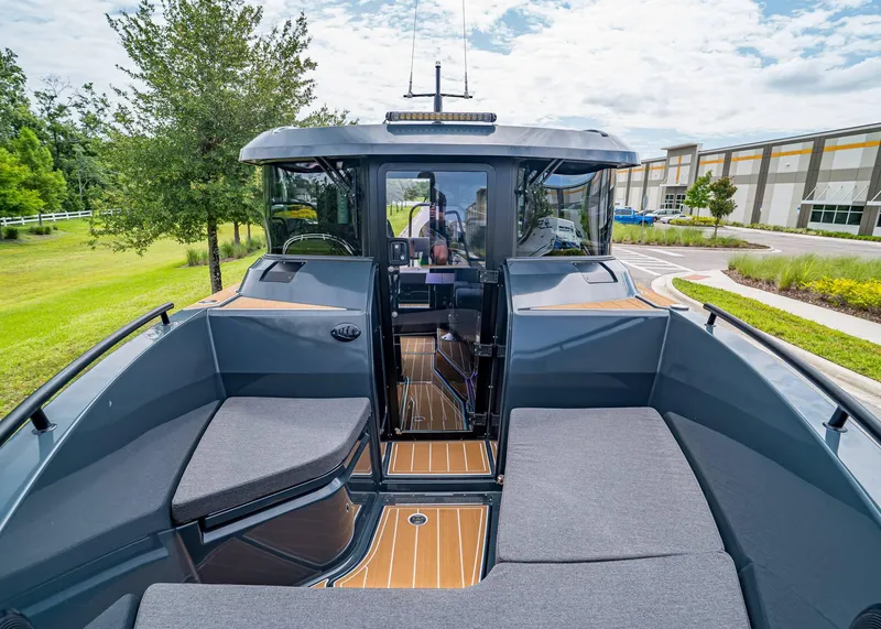 Slide: The Image of 2023 XO Boats EXPLR 9 interior with modern seating and sleek design. - 24