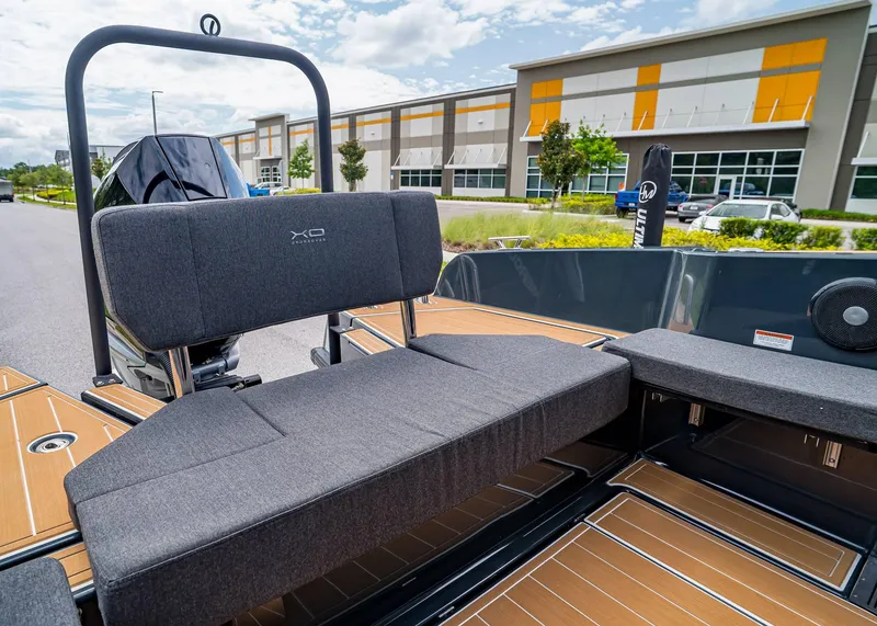 Slide: The Image of 2023 XO Boats EXPLR 9 interior seating with modern design and outdoor setting. - 27