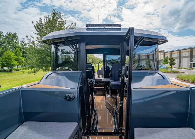 Slide: The Image of 2023 XO Boats EXPLR 9, sleek design, spacious interior, outdoor setting, modern features. - 28