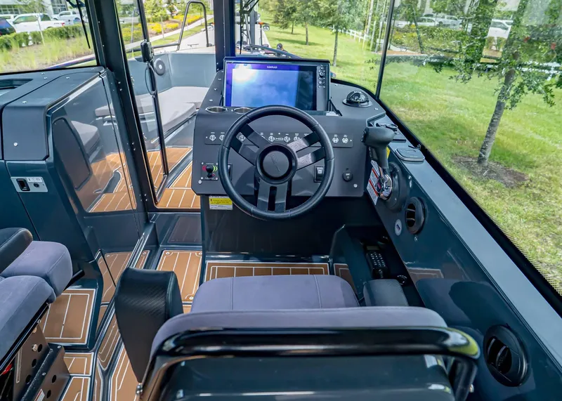 Slide: The Image of 2023 XO Boats EXPLR 9 cockpit with modern controls and sleek design. - 8