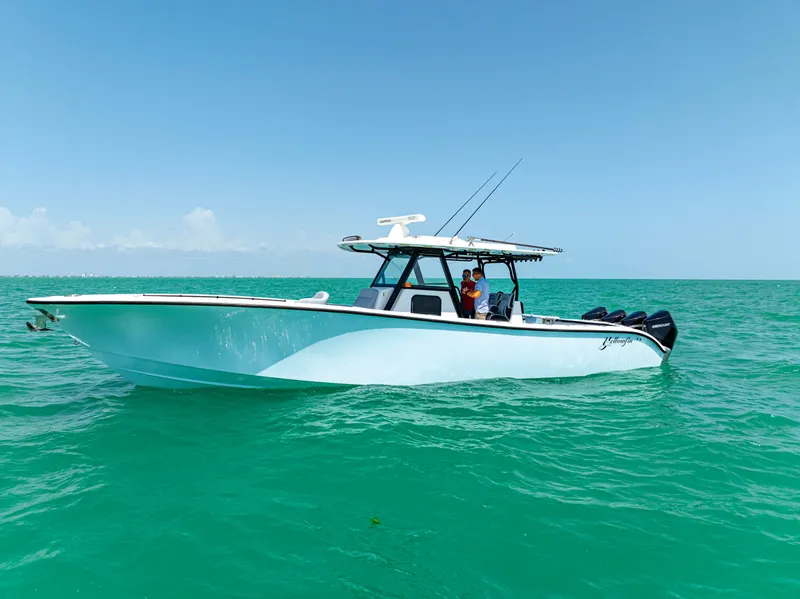 The Image of 2022 Yellowfin 39 boat on turquoise water under clear blue sky. - 0