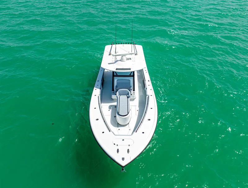 Slide: The Image of 2022 Yellowfin 39 boat on turquoise water, aerial view. - 12