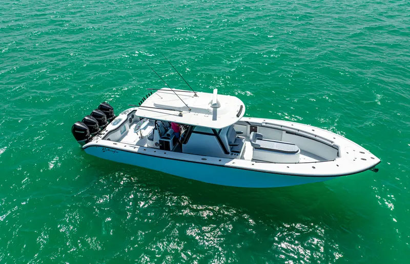 Slide: The Image of 2022 Yellowfin 39 boat on clear turquoise water, aerial view. - 14