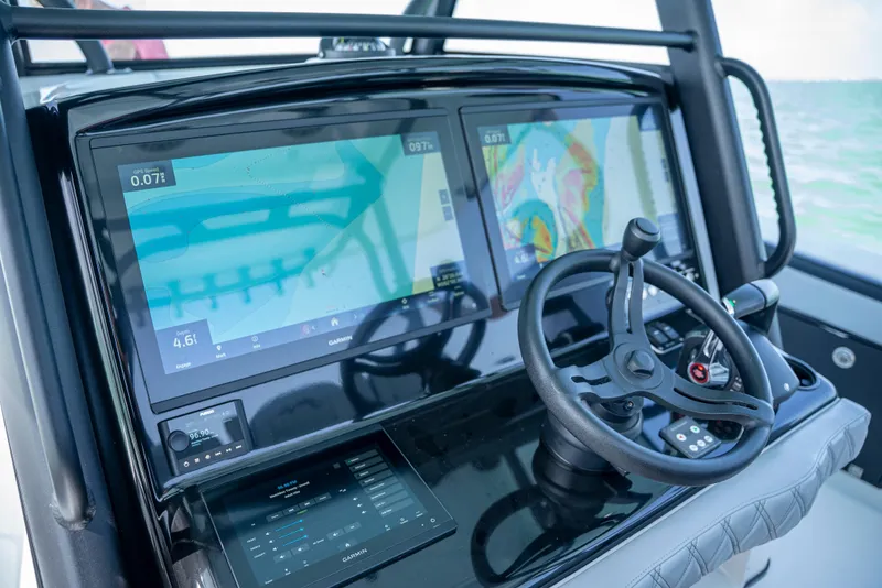 Slide: The Image of 2022 Yellowfin 39 boat dashboard with dual navigation screens and steering wheel. - 17