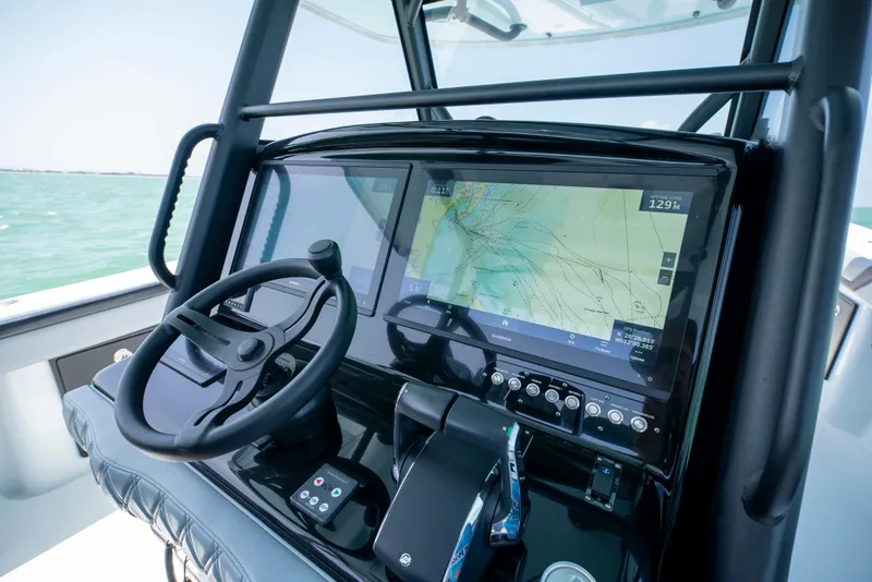 Slide: The Image of 2022 Yellowfin 39 boat dashboard with navigation system and steering wheel. - 19