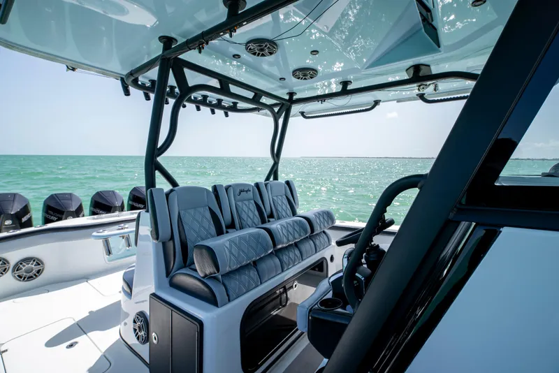 Slide: The Image of 2022 Yellowfin 39 boat interior with luxurious seating and ocean view. - 20