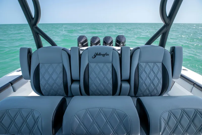 Slide: The Image of 2022 Yellowfin 39 boat interior with luxurious seating and ocean view. - 22