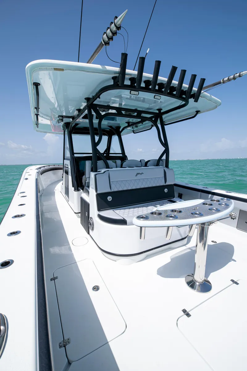 Slide: The Image of 2022 Yellowfin 39 boat with sleek design, spacious deck, and fishing rod holders. - 24