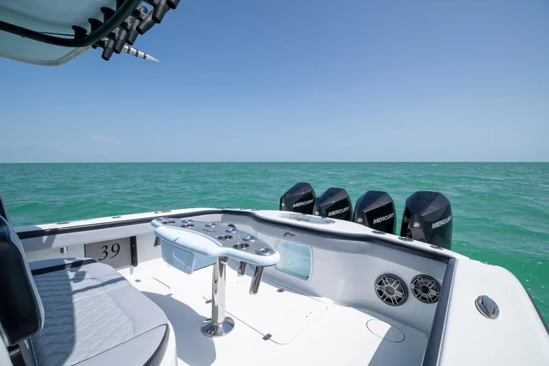 Slide: The Image of 2022 Yellowfin 39 boat with multiple engines on open sea. - 26
