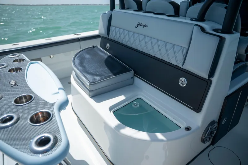 Slide: The Image of 2022 Yellowfin 39 boat interior with seating and fishing rod holders. - 27