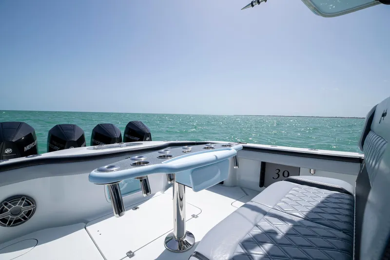 Slide: The Image of 2022 Yellowfin 39 boat interior with ocean view and multiple outboard motors. - 29