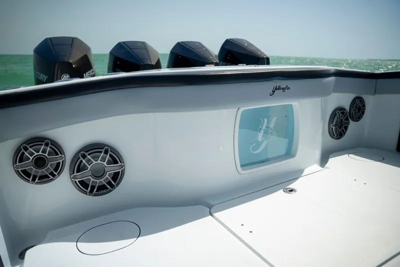 Slide: The Image of 2022 Yellowfin 39 boat with multiple outboard motors and sleek interior design. - 30