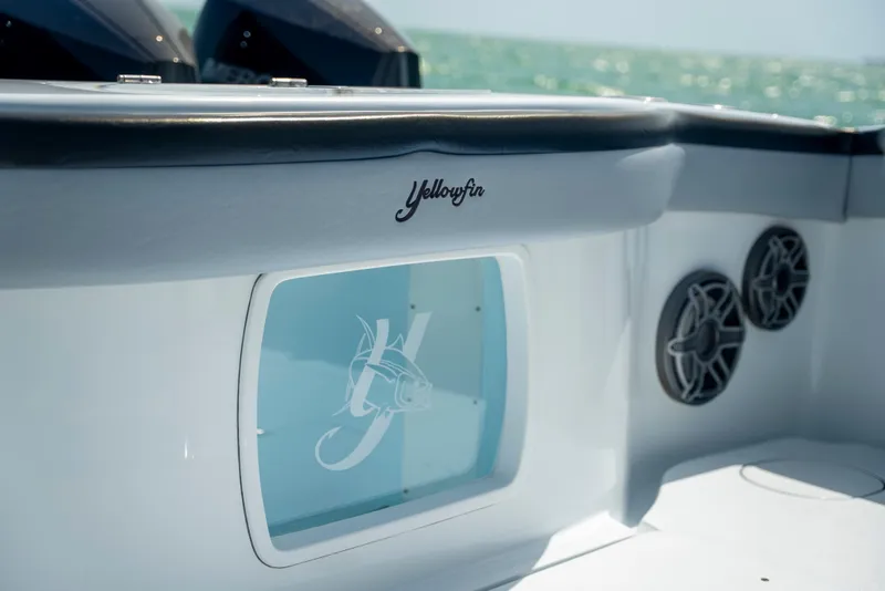 Slide: The Image of 2022 Yellowfin 39 boat interior with logo and speakers, ocean in background. - 31