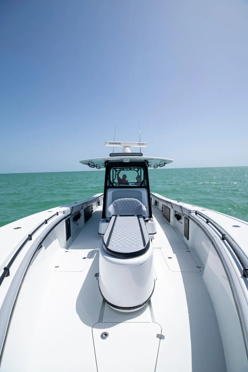Slide: The Image of 2022 Yellowfin 39 boat on open sea under clear blue sky. - 32