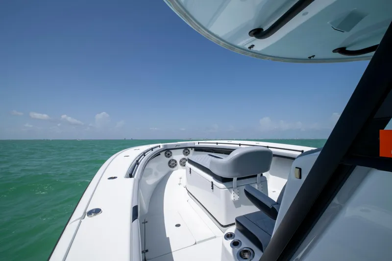 Slide: The Image of 2022 Yellowfin 39 boat on open sea under clear blue sky. - 36
