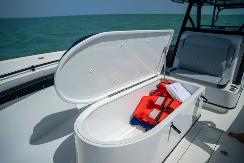 Slide: The Image of 2022 Yellowfin 39 boat with open storage compartment and life jacket. - 40