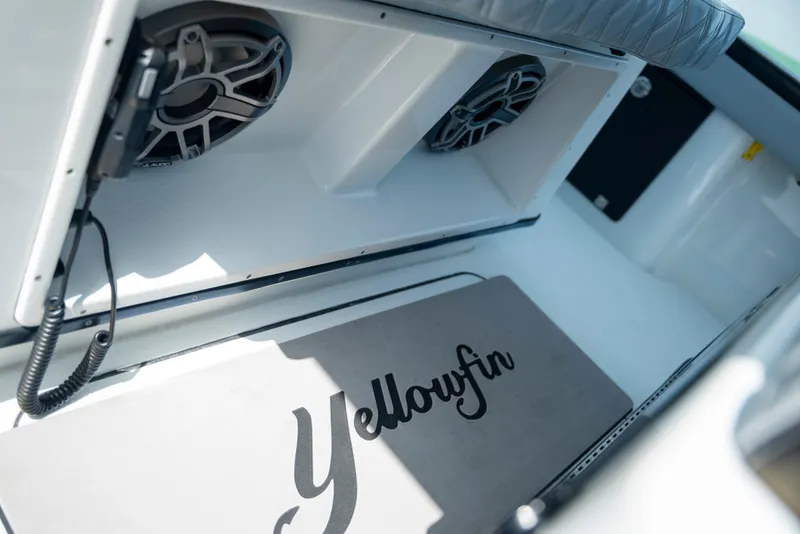 Slide: The Image of 2022 Yellowfin 39 boat interior with speakers and branded mat. - 46