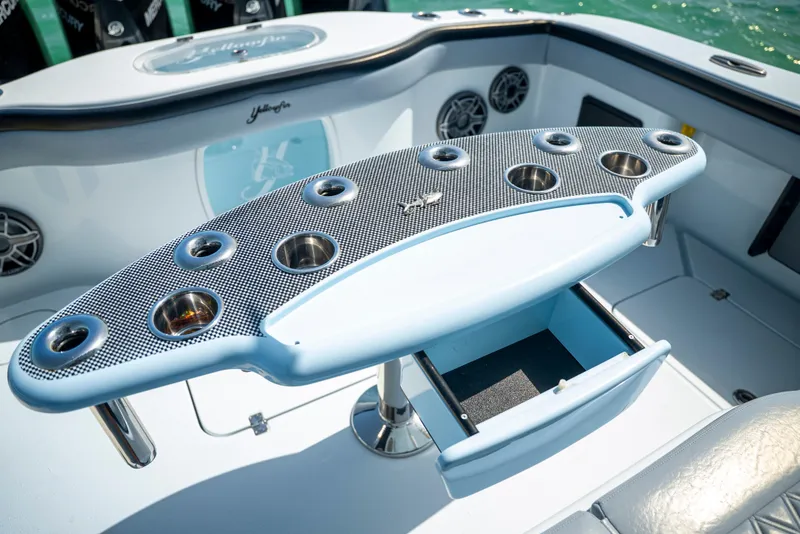 Slide: The Image of 2022 Yellowfin 39 boat interior with rod holders and storage compartments. - 52