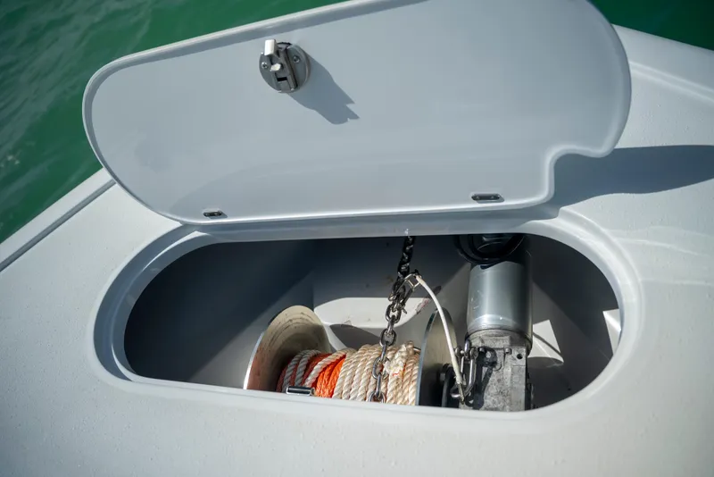 Slide: The Image of Anchor storage compartment on 2022 Yellowfin 39 boat, featuring rope and chain. - 53