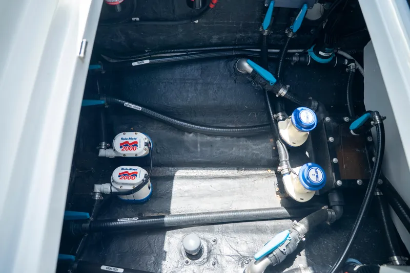 Slide: The Image of Engine compartment of 2022 Yellowfin 39 boat with visible wiring and components. - 54