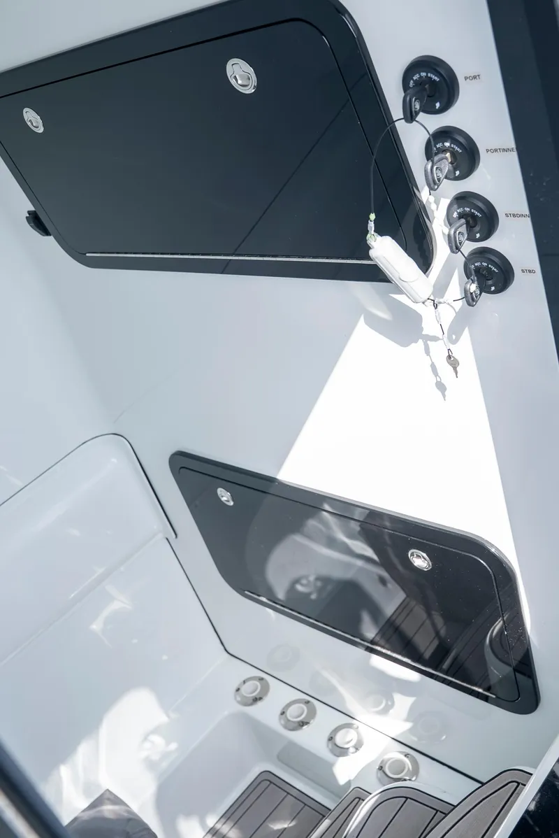 Slide: The Image of 2022 Yellowfin 39 boat interior with storage compartments and control panel. - 56