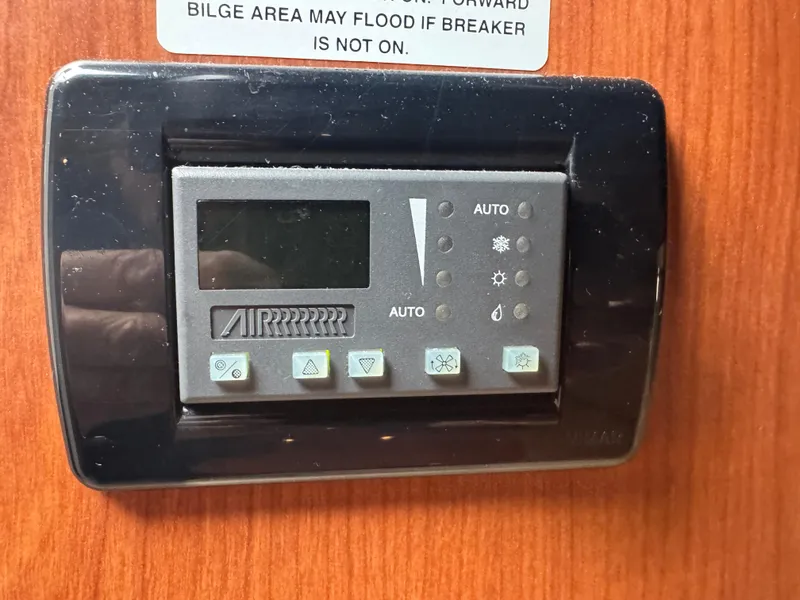 Slide: The Image of Control panel on 2004 Chaparral 290 Signature boat, mounted on wooden surface. - 20