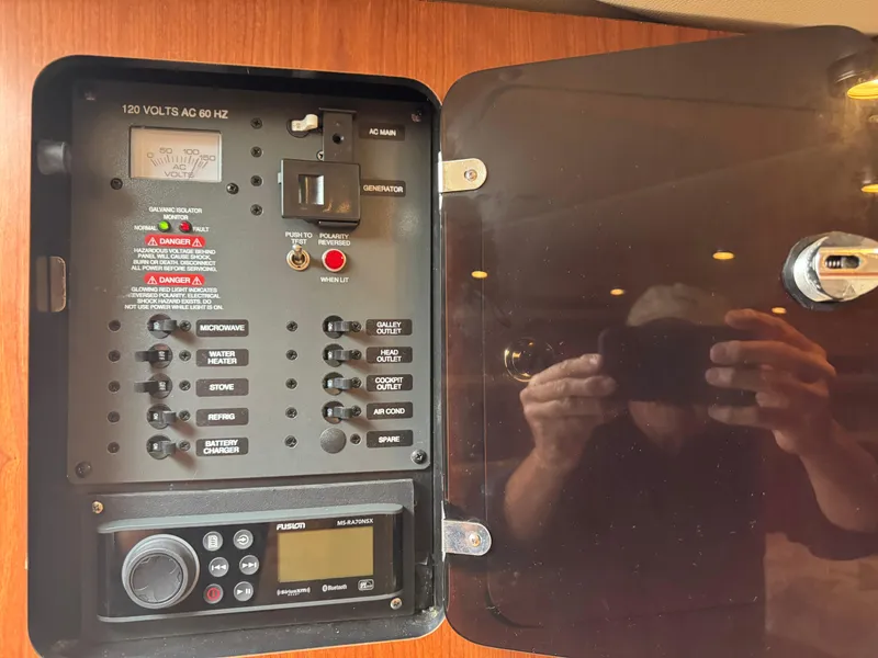 Slide: The Image of Electrical control panel inside a 2004 Chaparral 290 Signature boat. - 21