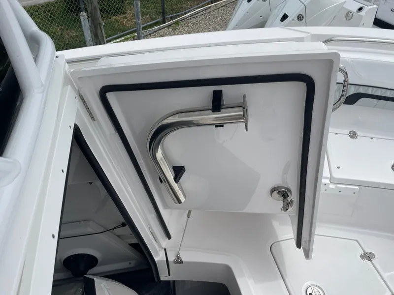 Slide: The Image of 2026 Blackfin 222CC boat storage compartment with stainless steel hardware. - 14