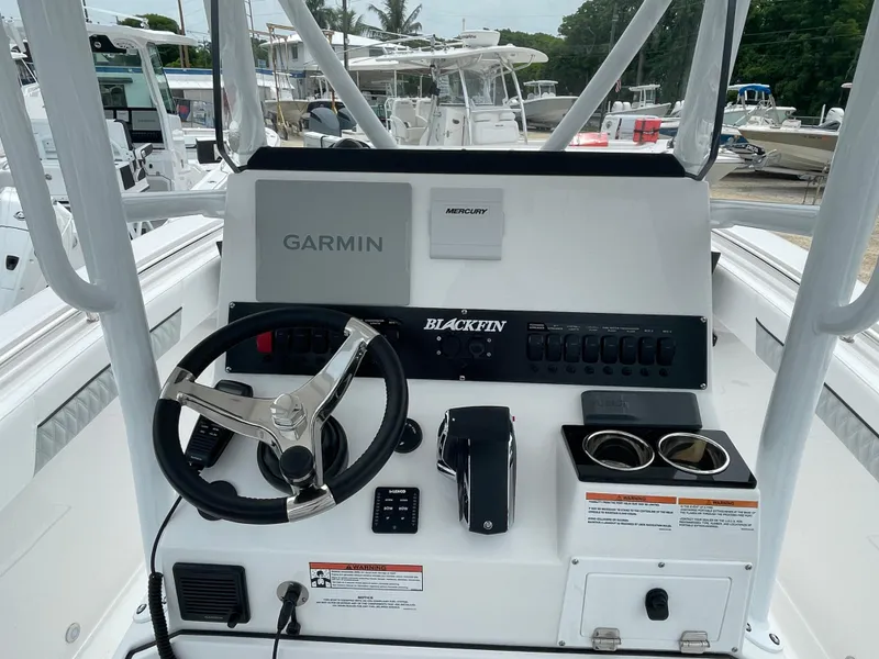 Slide: The Image of 2026 Blackfin 222CC boat console with Garmin and Mercury controls. - 16