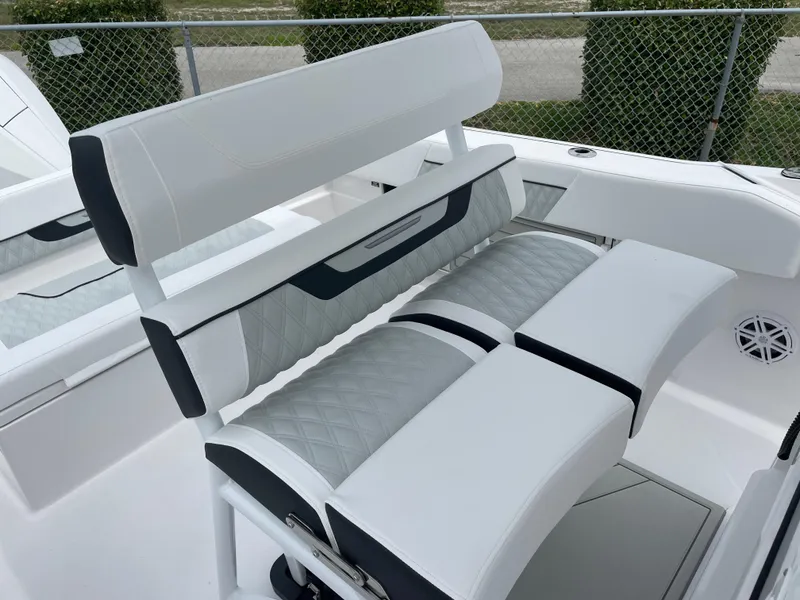 Slide: The Image of 2026 Blackfin 222CC boat seating with white and gray upholstery, featuring quilted design. - 18