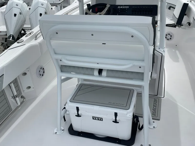 Slide: The Image of 2026 Blackfin 222CC boat interior with Yeti cooler under seat. - 19