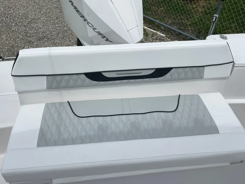 Slide: The Image of 2026 Blackfin 222CC boat seating with white and gray upholstery. - 22