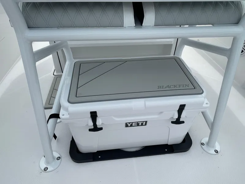 Slide: The Image of YETI cooler on 2026 Blackfin 222CC boat, under seat storage. - 24