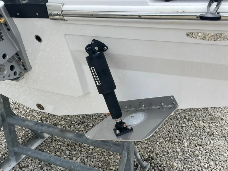 Slide: The Image of 2026 Blackfin 222CC boat trim tab and actuator on display. - 33